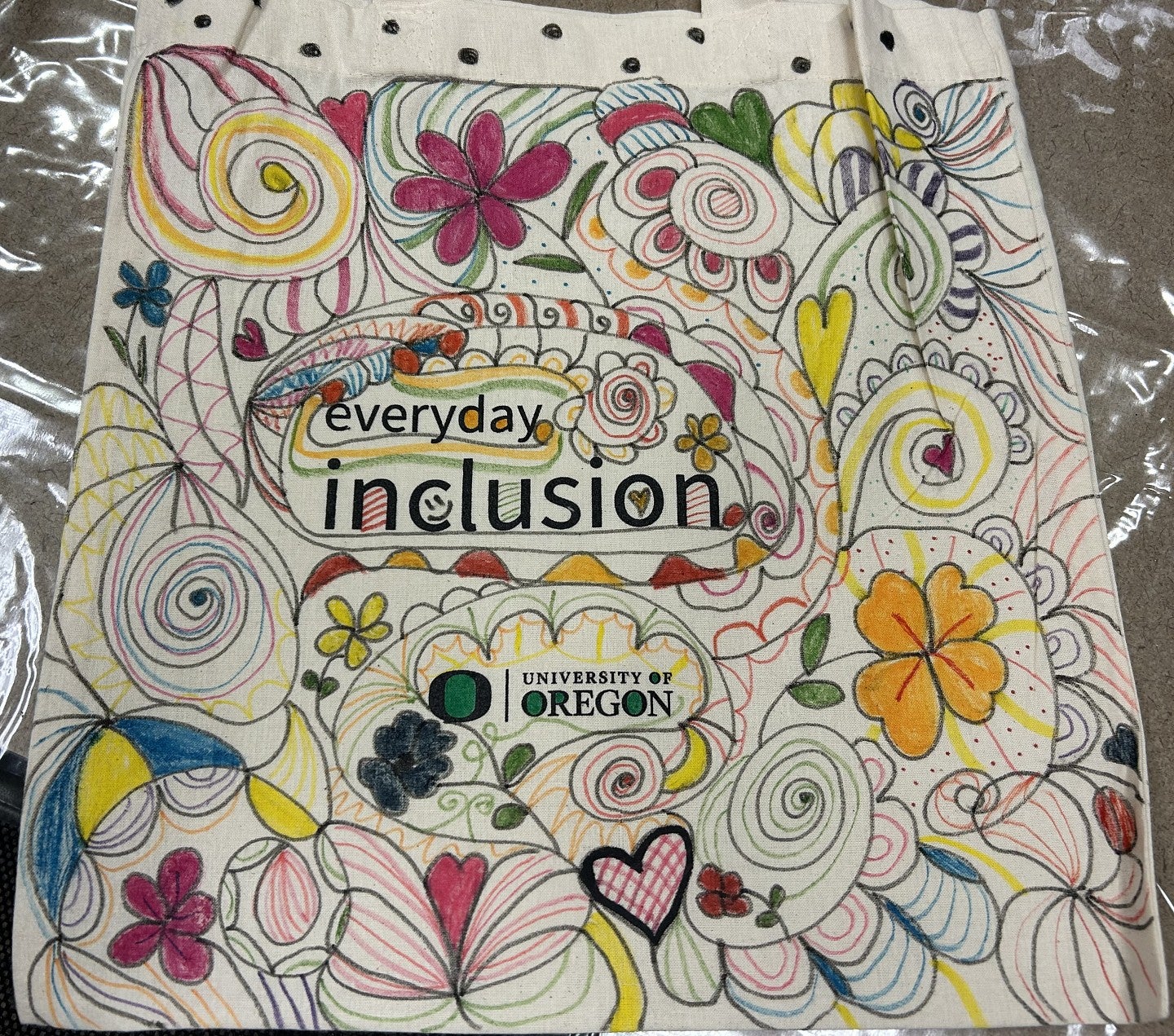 Everyday Inclusion tote bag with flowers and spirals