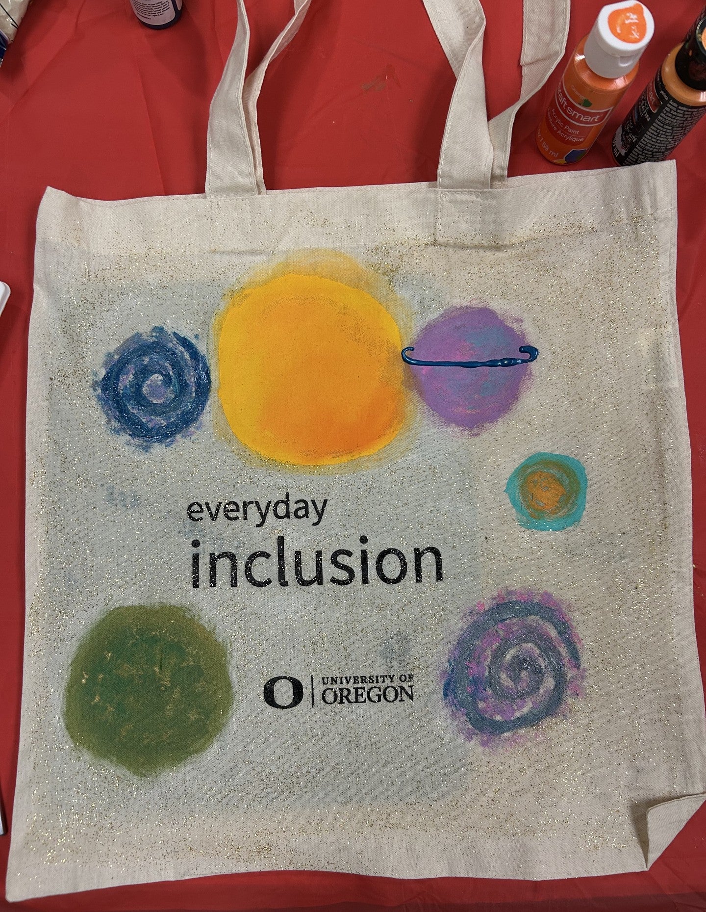 Everyday Inclusion tote bag with the sun, planets, and stars