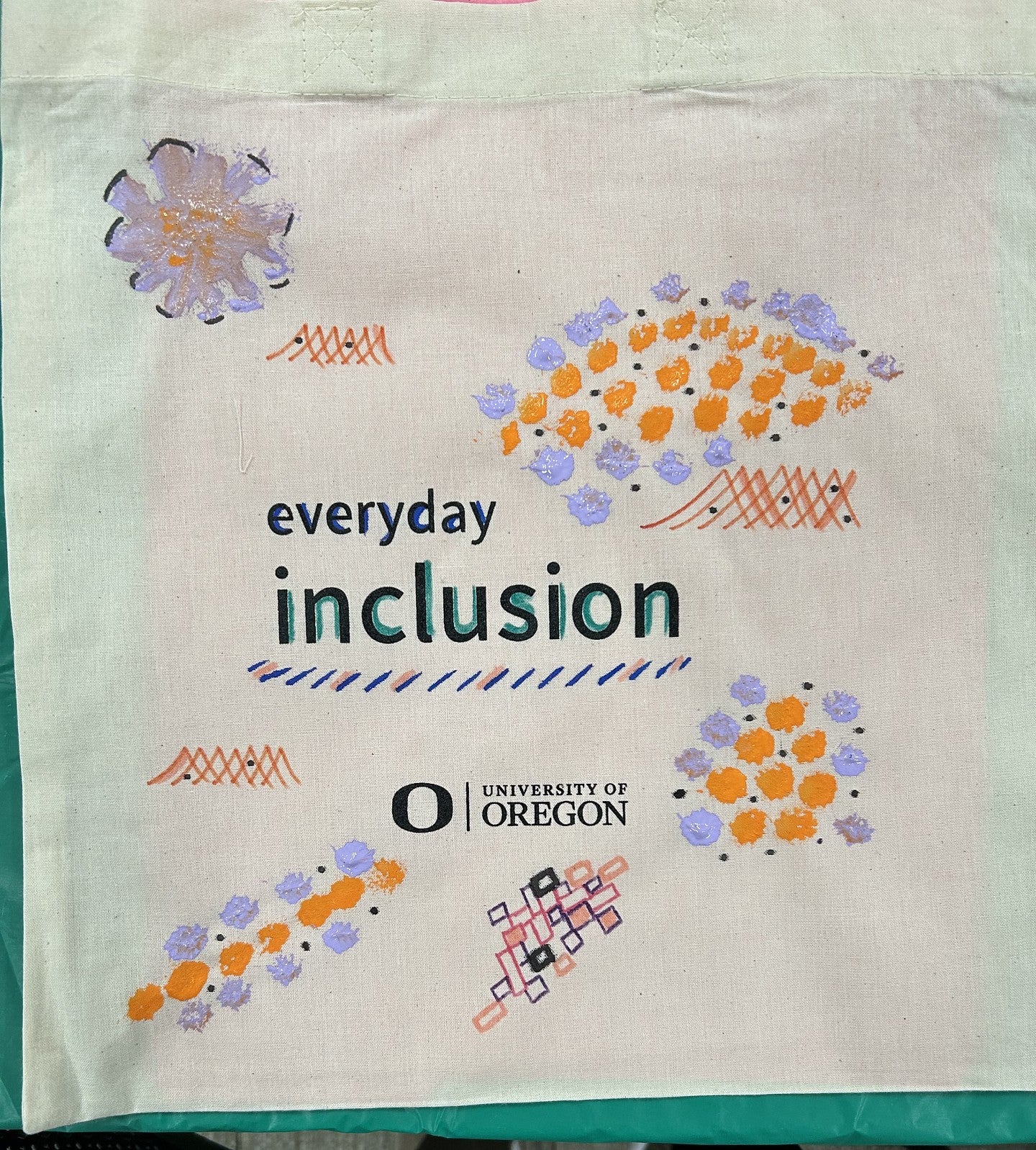 Everyday Inclusion bag with orange and purple splotch designs