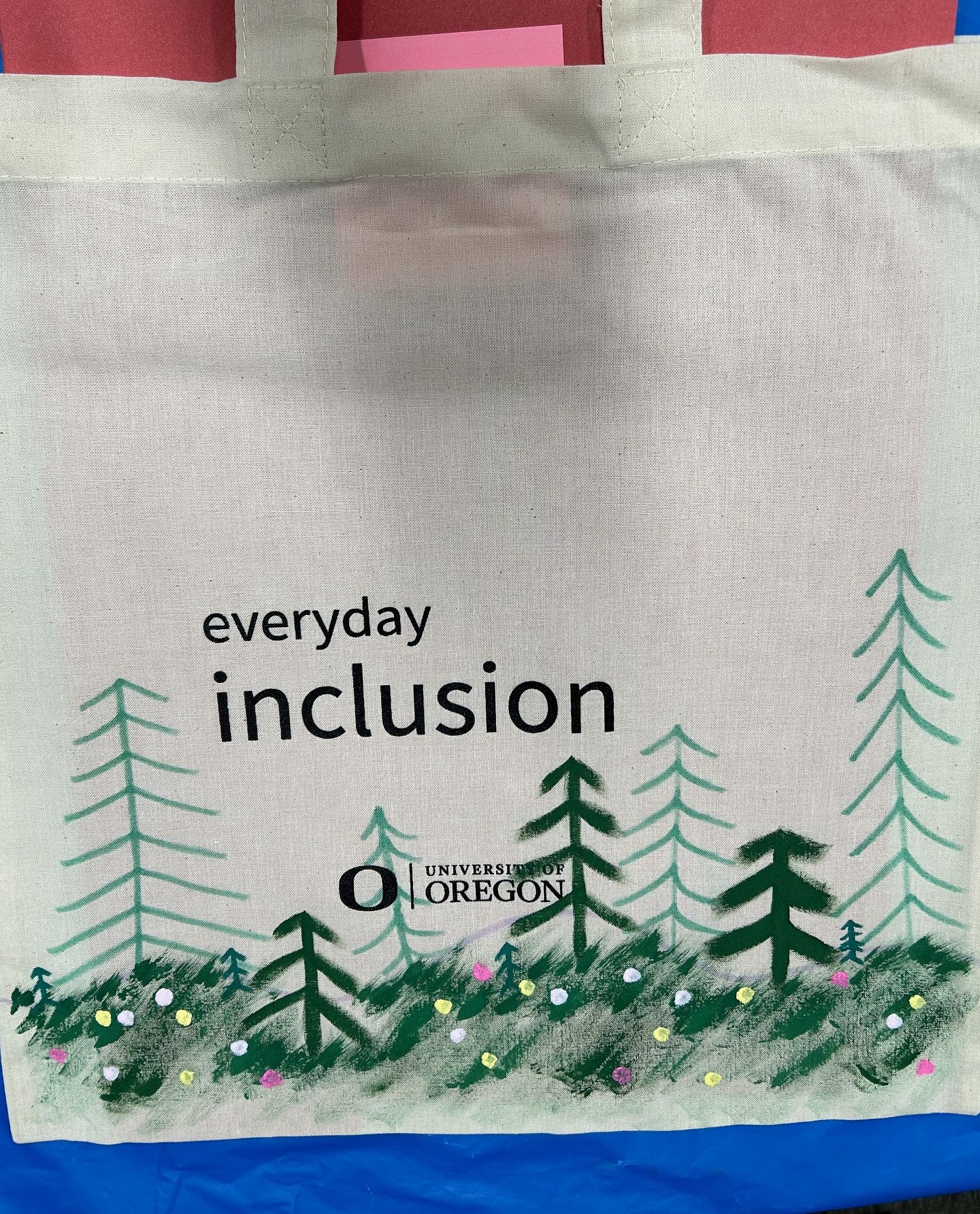 Everyday Inclusion bag with trees, grass, and flowers