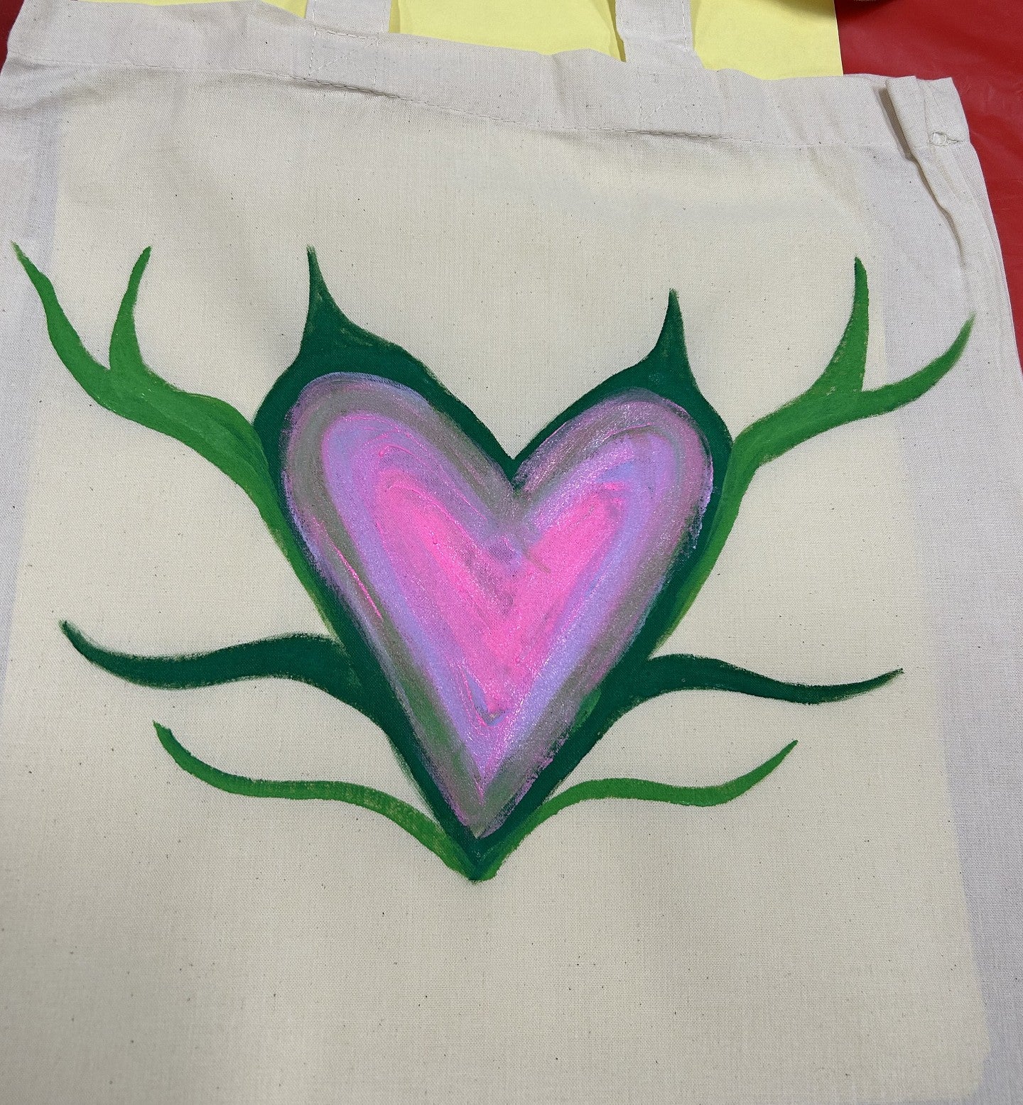 Everyday Inclusion bag with a green and pink heart