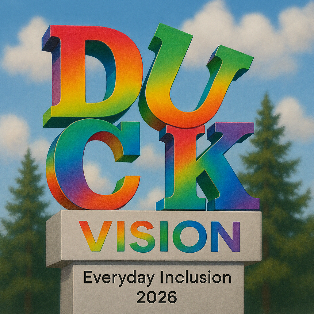 Duck Vision letters in rainbox 3D - style of Philly Love statue. Everyday Inclusion 2026 on cement block underneath. Trees and blue sky in background