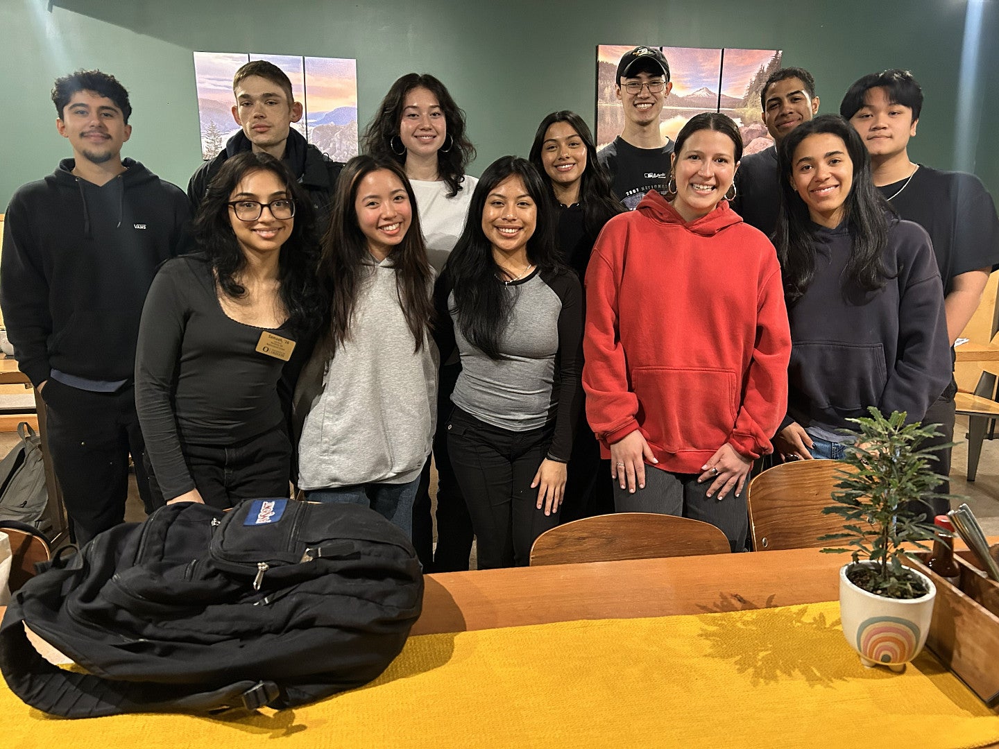 2025-26 cohort: 12 undergrads smiling at the camera